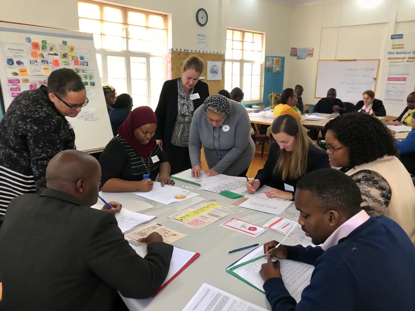 A diverse group of professionals participating in a hands-on training session, focusing on collaborative problem-solving and skill development, set in a modern training facility.